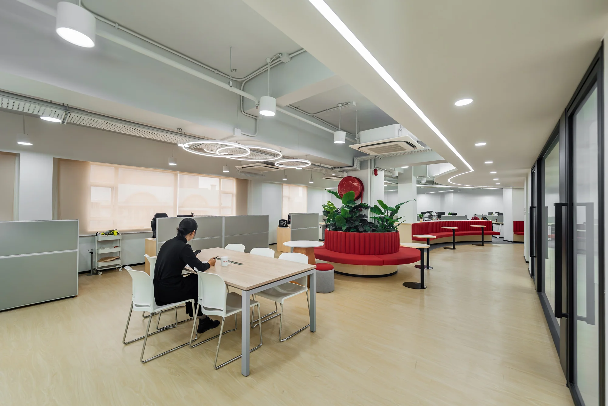Bright collaborative workplace with red seating
